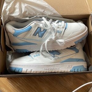 Brand new, never worn, New Balance sneakers. Women size 11, men size 9.5